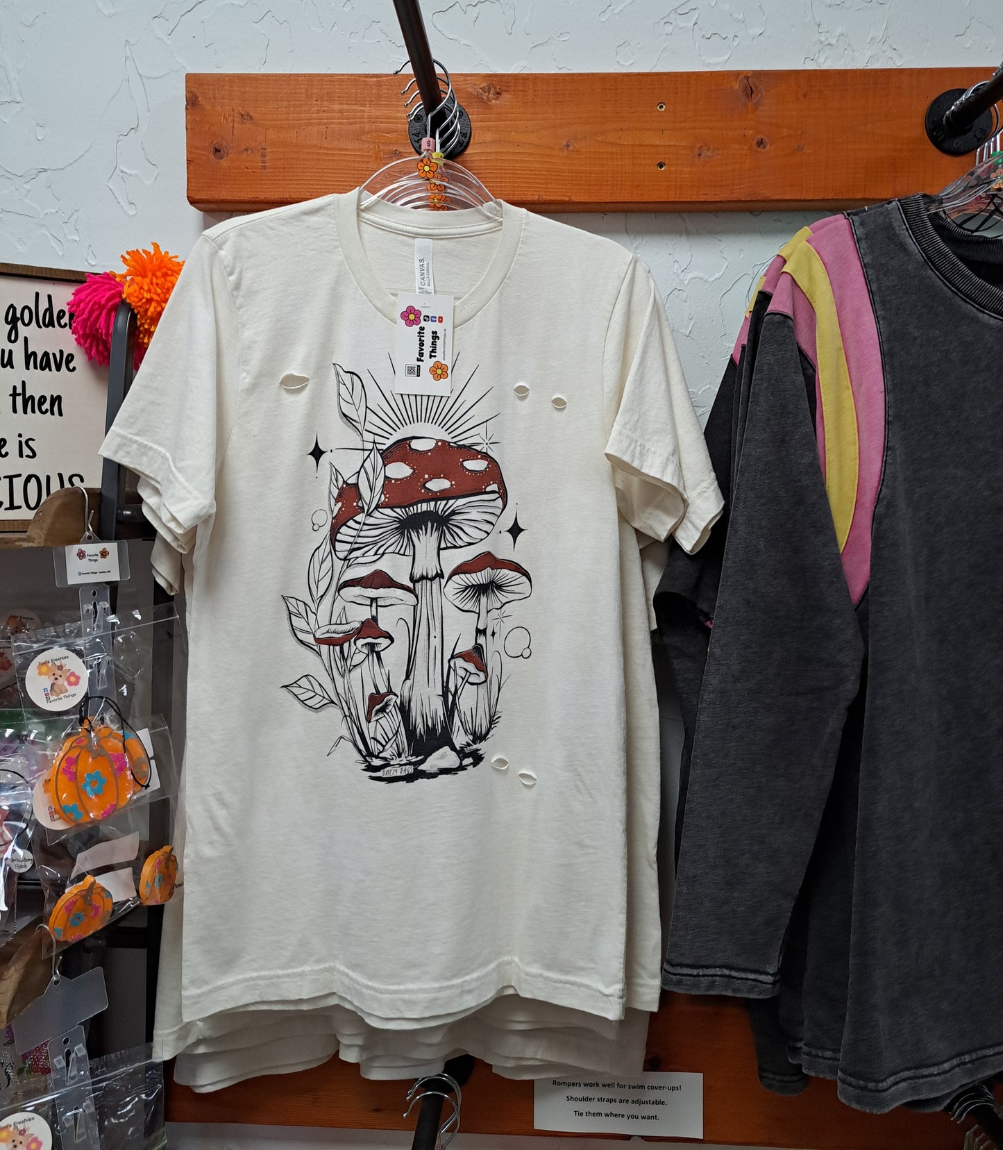 mushroom tee hanging in a store