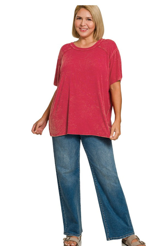 Woman wearing a red top and blue jeans on a white background