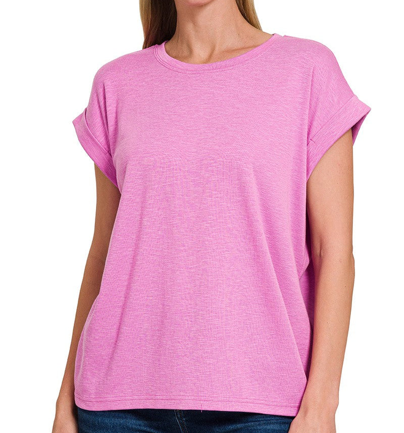 a woman is wearing a lilac magenta stretchy knit top with loose fit and rolled sleeve, front view