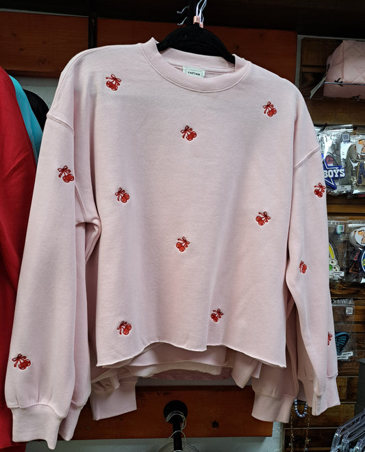Pink sweatshirt with red cherry emboidered areas throughout