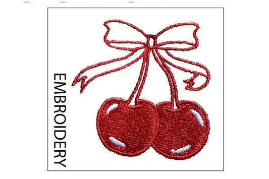 Embroidery design of two red cherries with a bow on a white background
