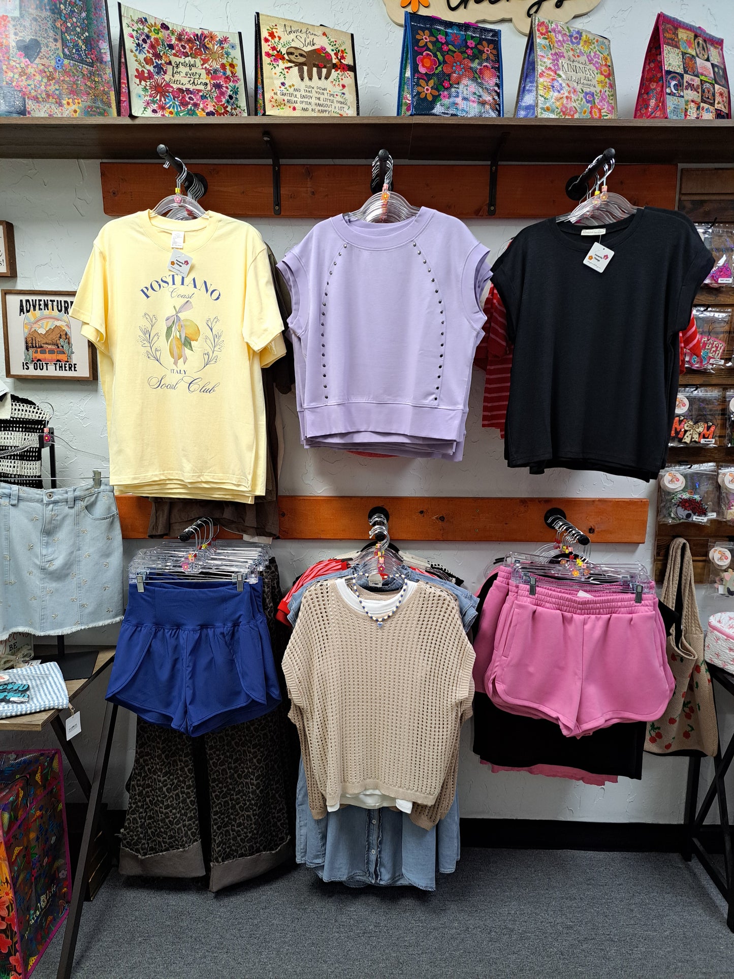 Collection of clothing and accessories on a table.