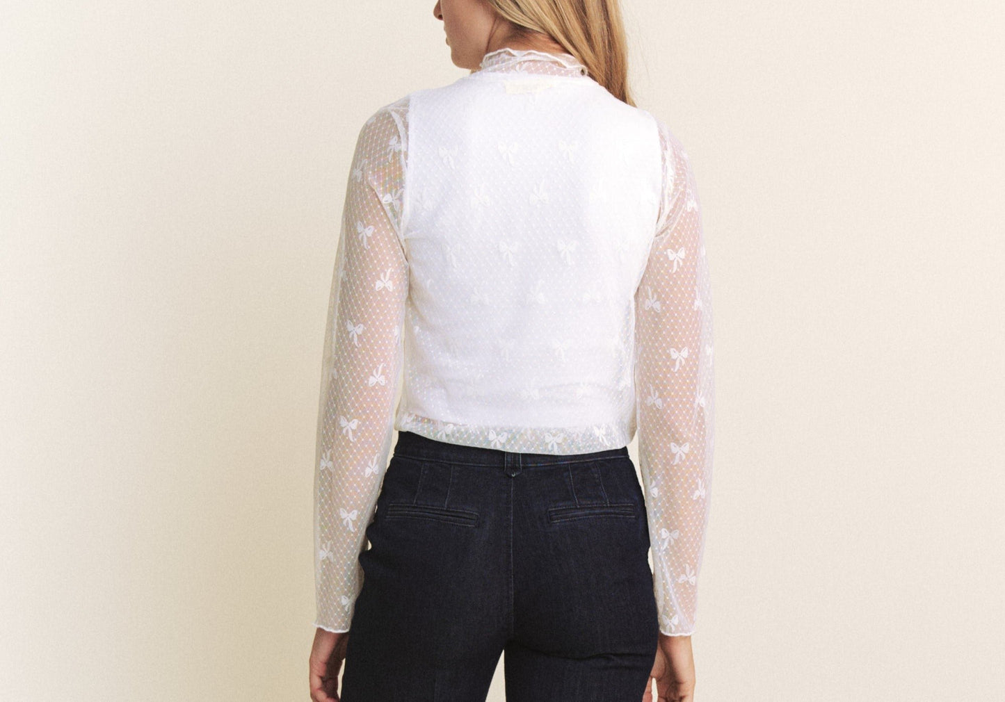 back of white mesh top