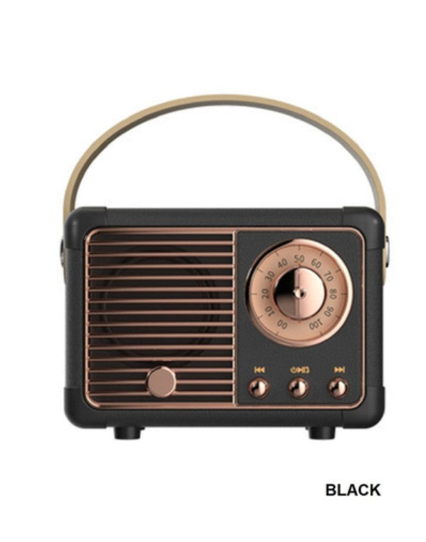 Vintage-style radio with black and bronze design on a white background