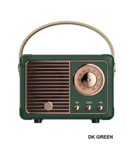 Vintage-style radio in dark green with bronze accents on a white background
