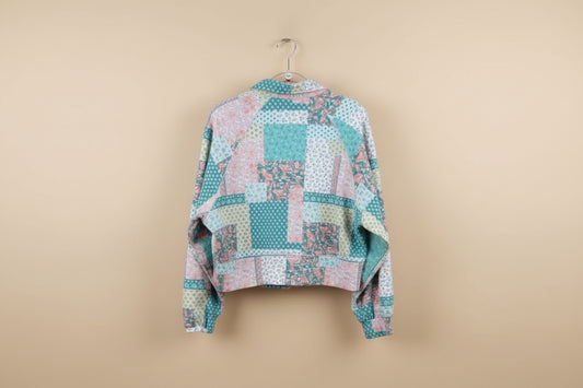 Patchwork quilt on a hanger outdoors