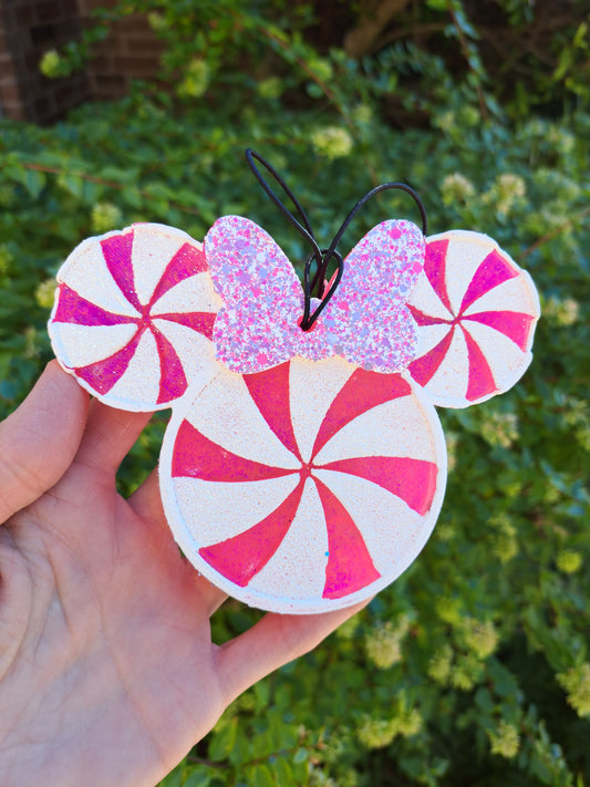 Round mouse shaped peppermint look freshie with bow on a greenery background