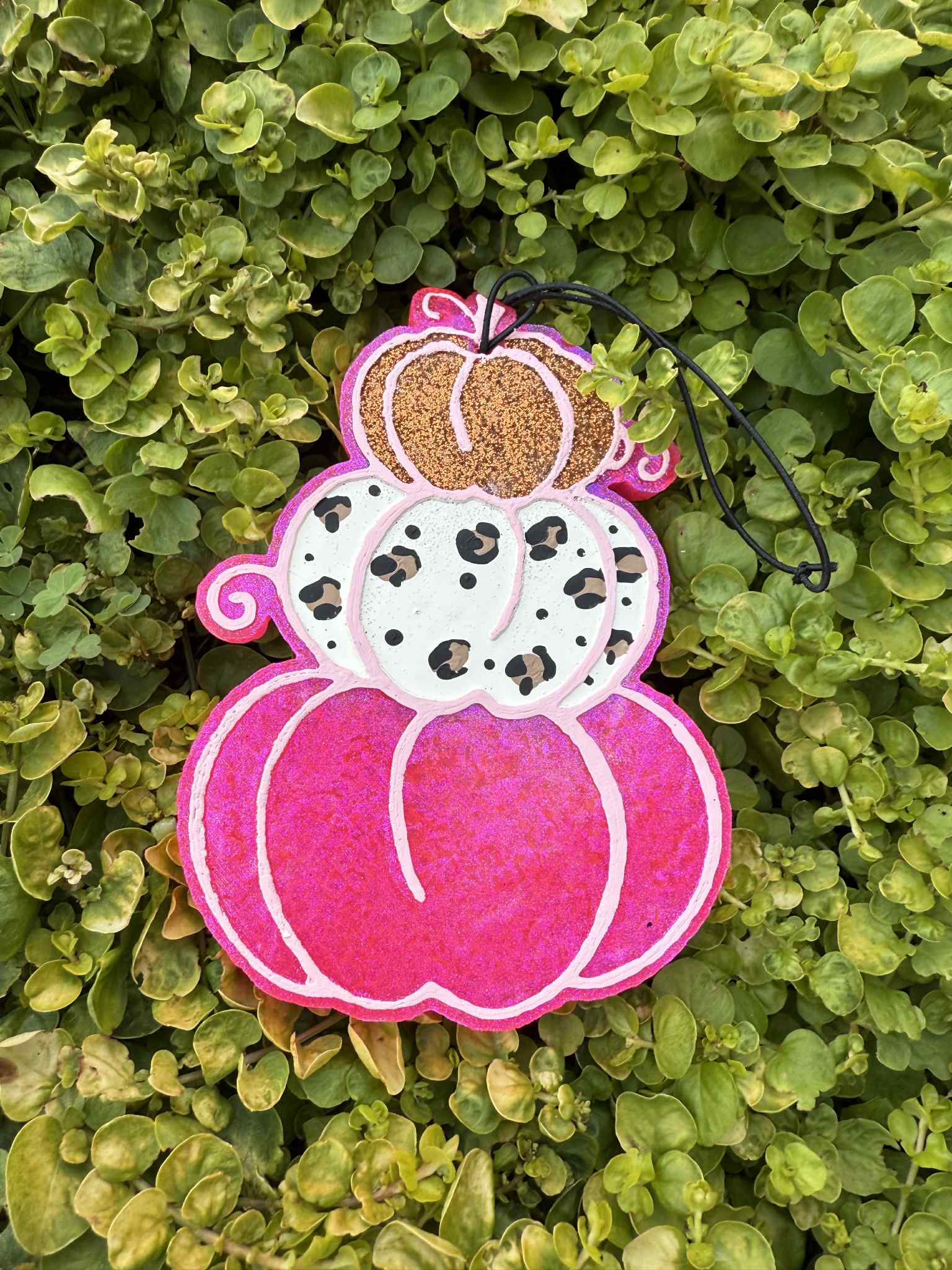 Pink pumpkin stack freshie with leopard print. Greenery background
