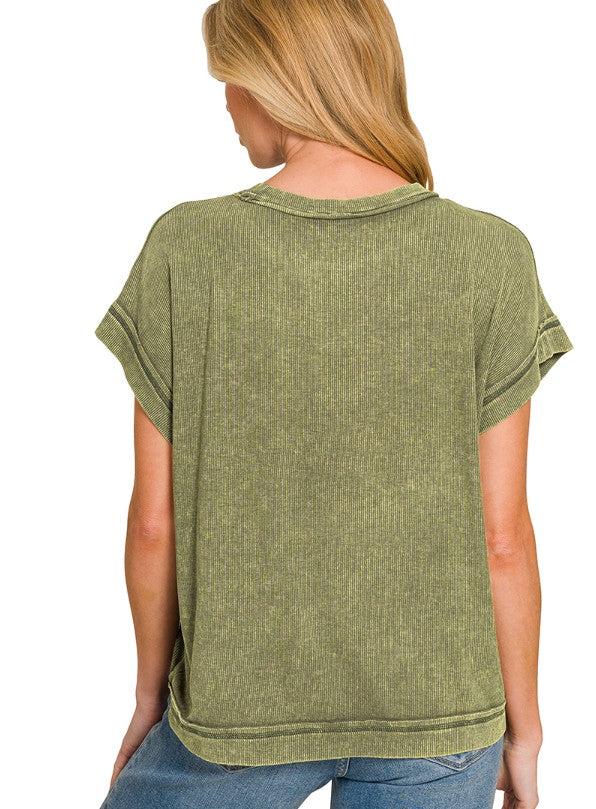 Woman wearing a green rayon top on a white background, back view