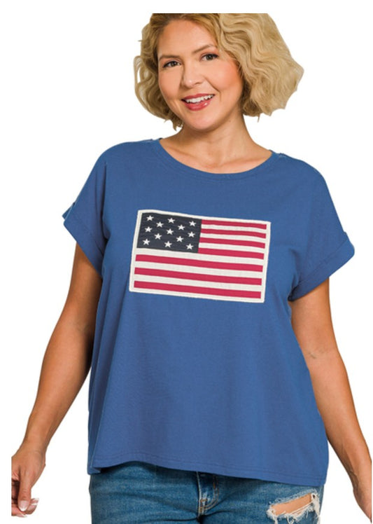 Woman wearing a blue t-shirt with an American flag design on a white background