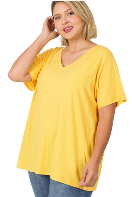Woman wearing a yellow oversized t-shirt on a white background
