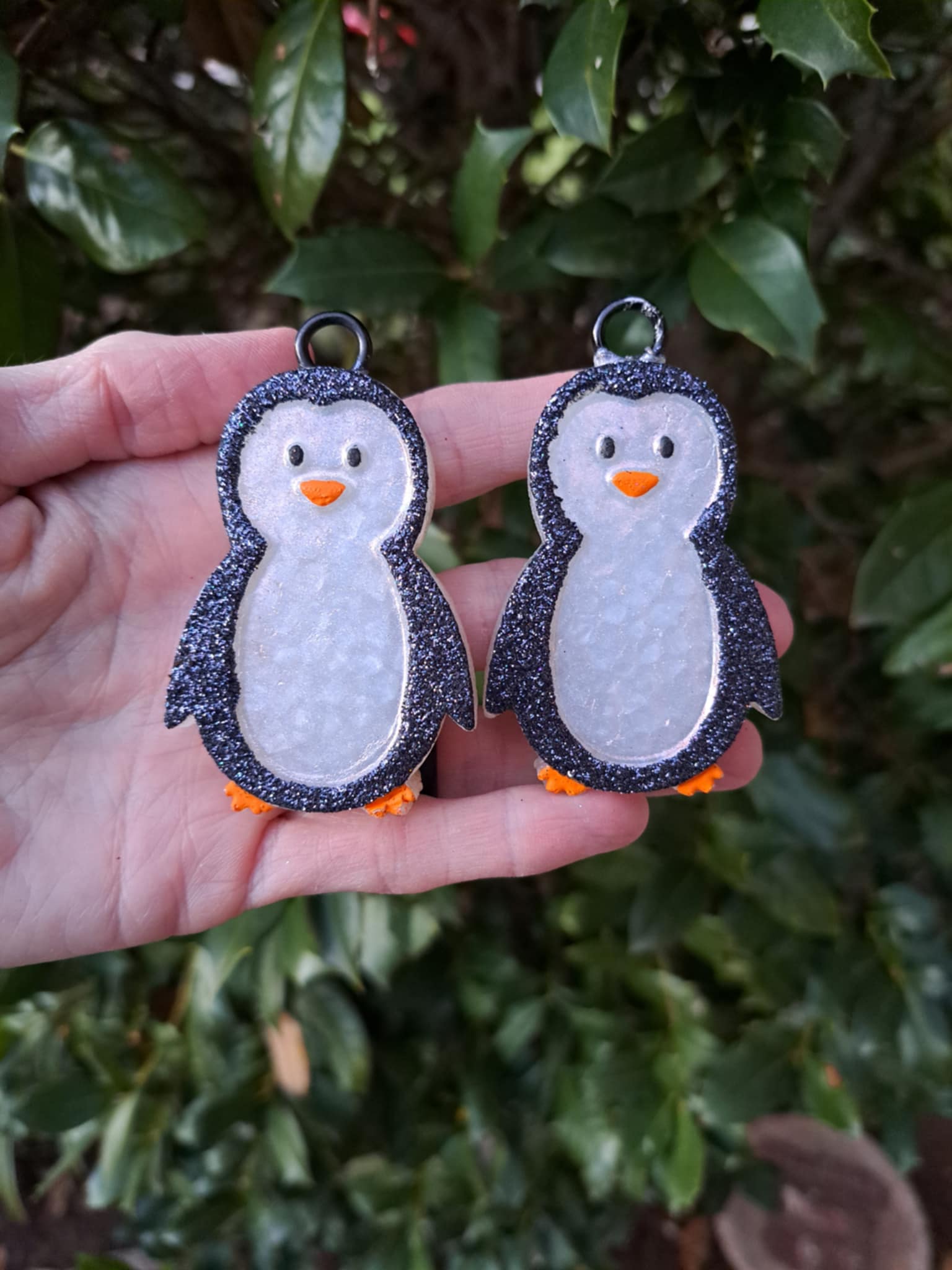 penguin vent clips held in front of greenery