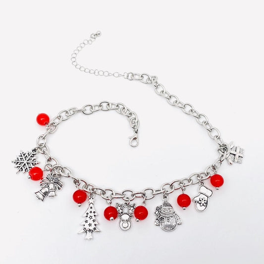 Christmas charm necklace on white background