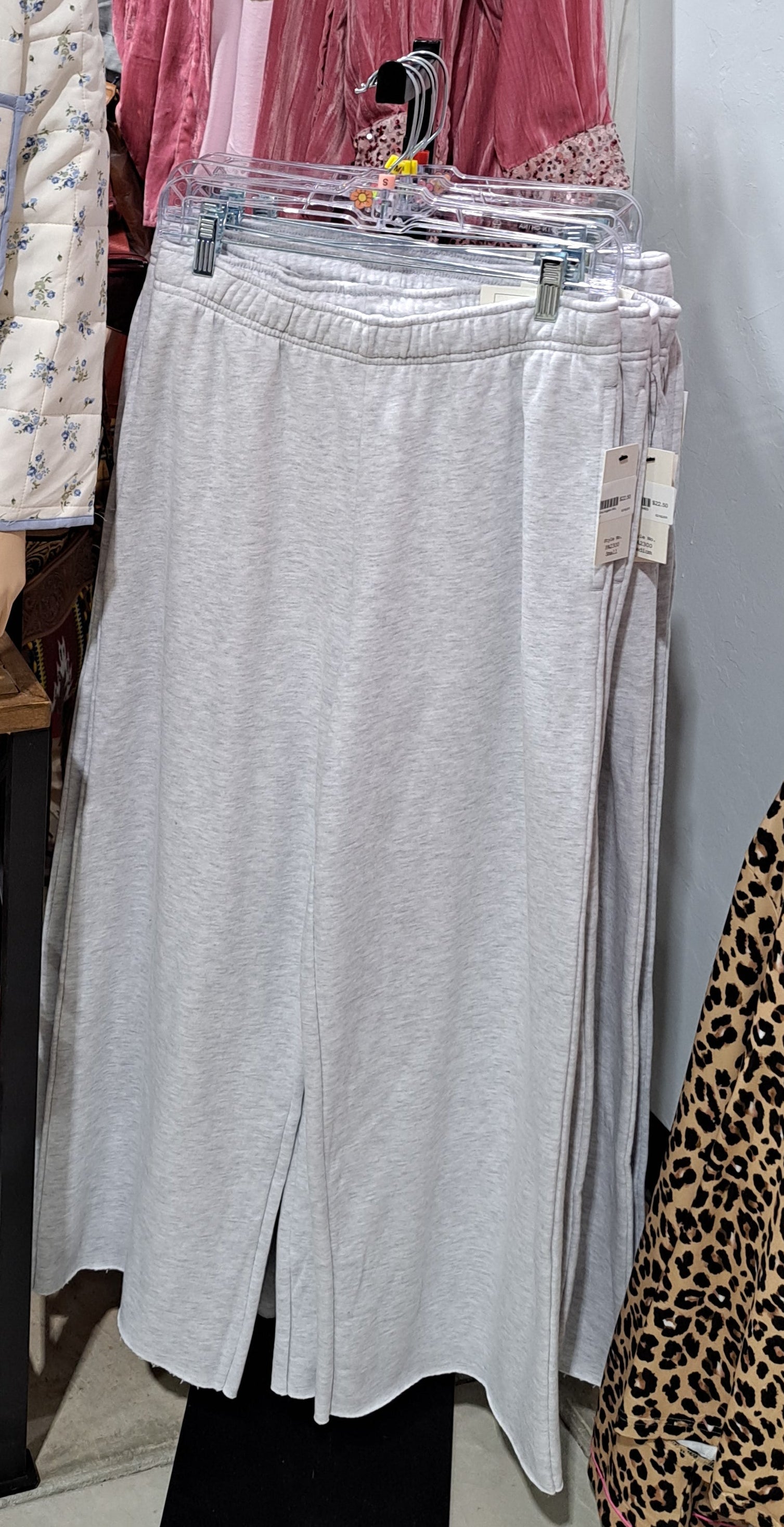 gray fleece wide leg jog pants on a rack in a store