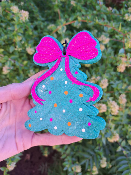 Polka Dot Holiday Tree Freshie with Pink bow on top held in front of greenery