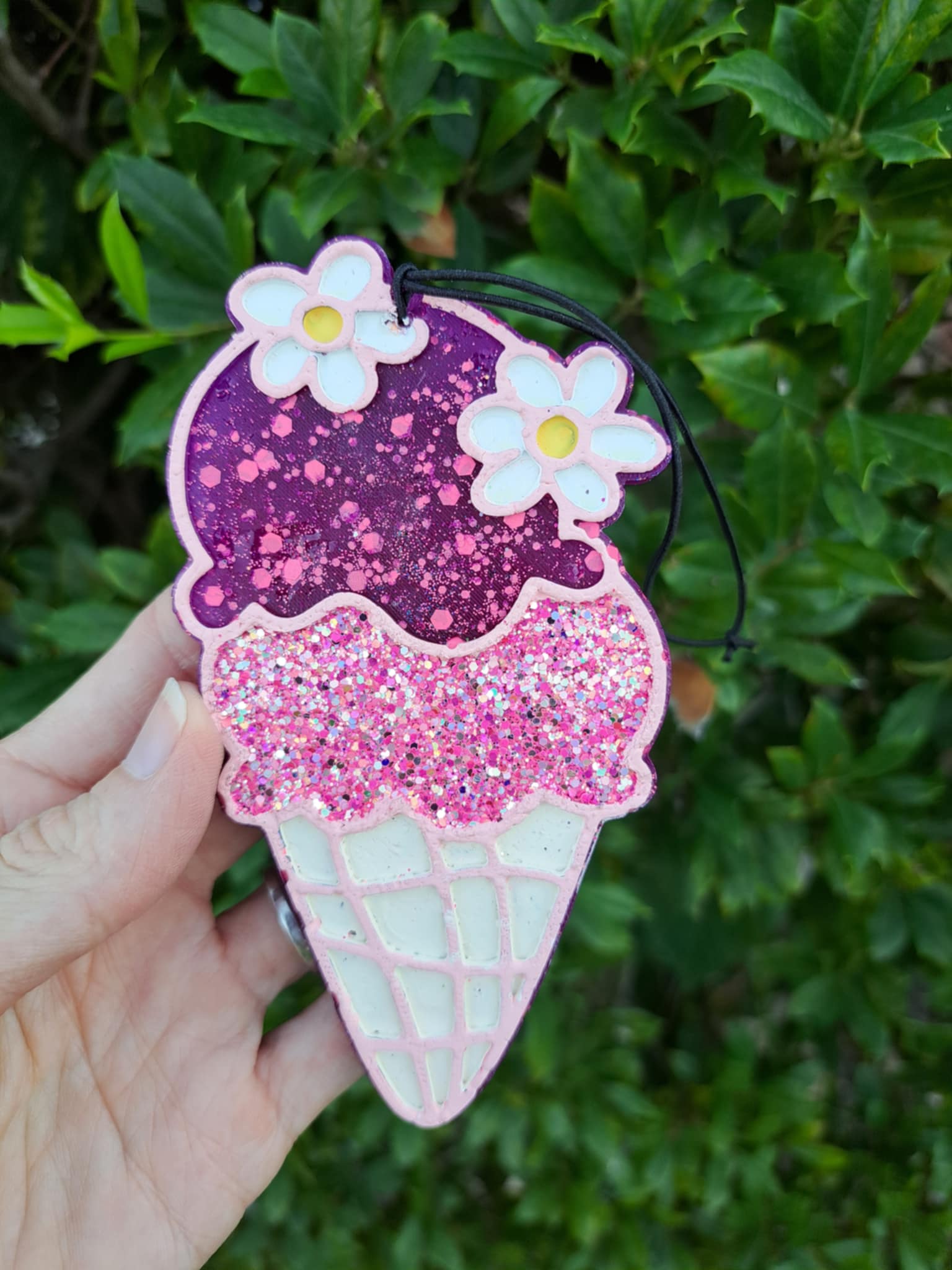 Ice cream cone air freshener with green background