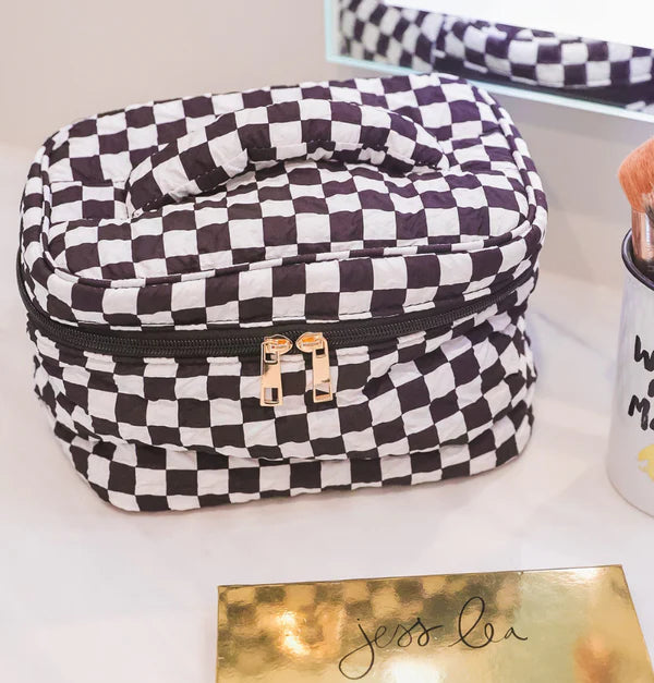 black white checkered bag on a white table