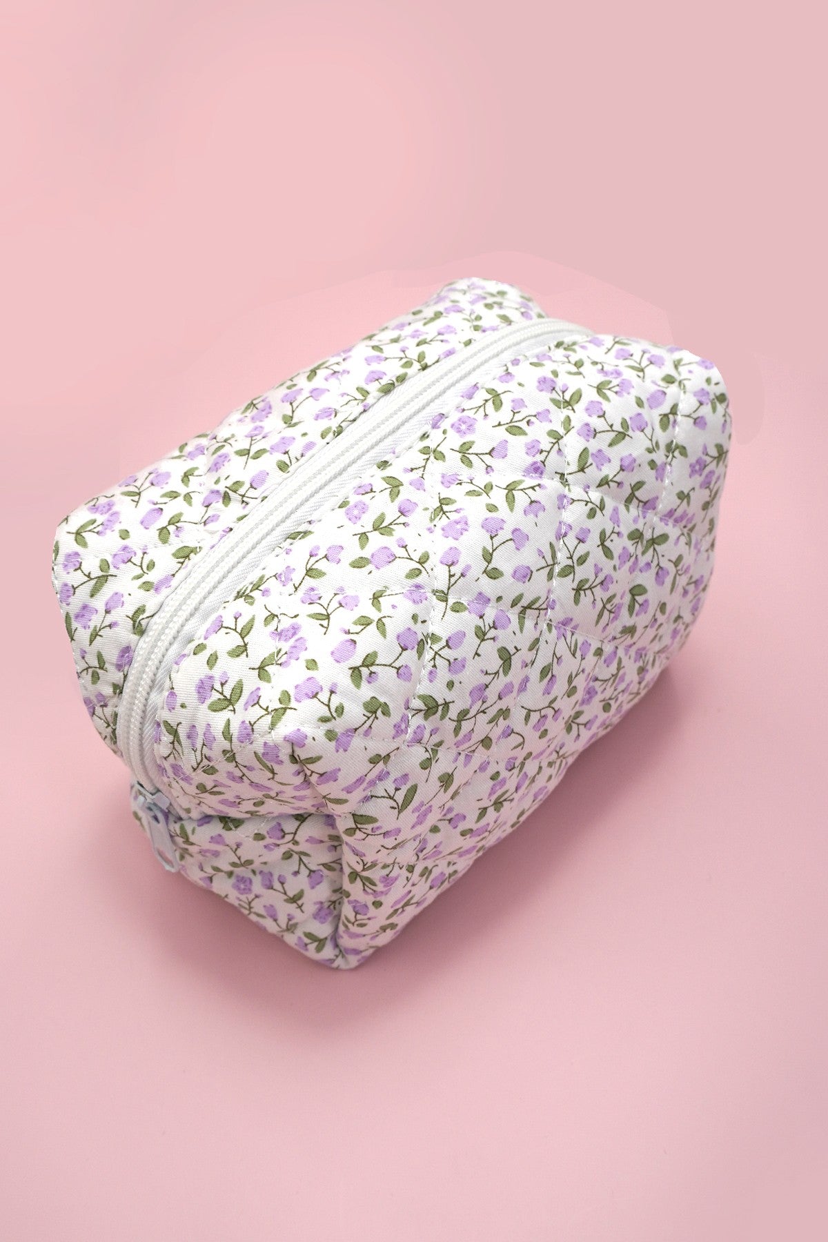 Lavendar Floral-patterned pouch on a pink background