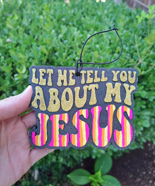 Let me tell you striped freshie in a hand with greenery background