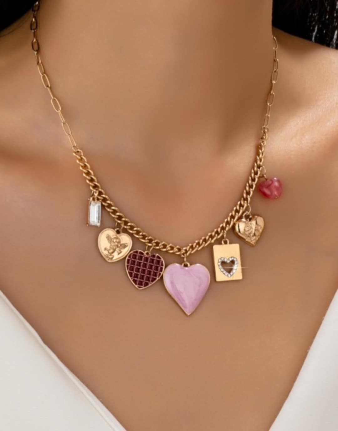 Necklace with heart-shaped charms on a woman's neck