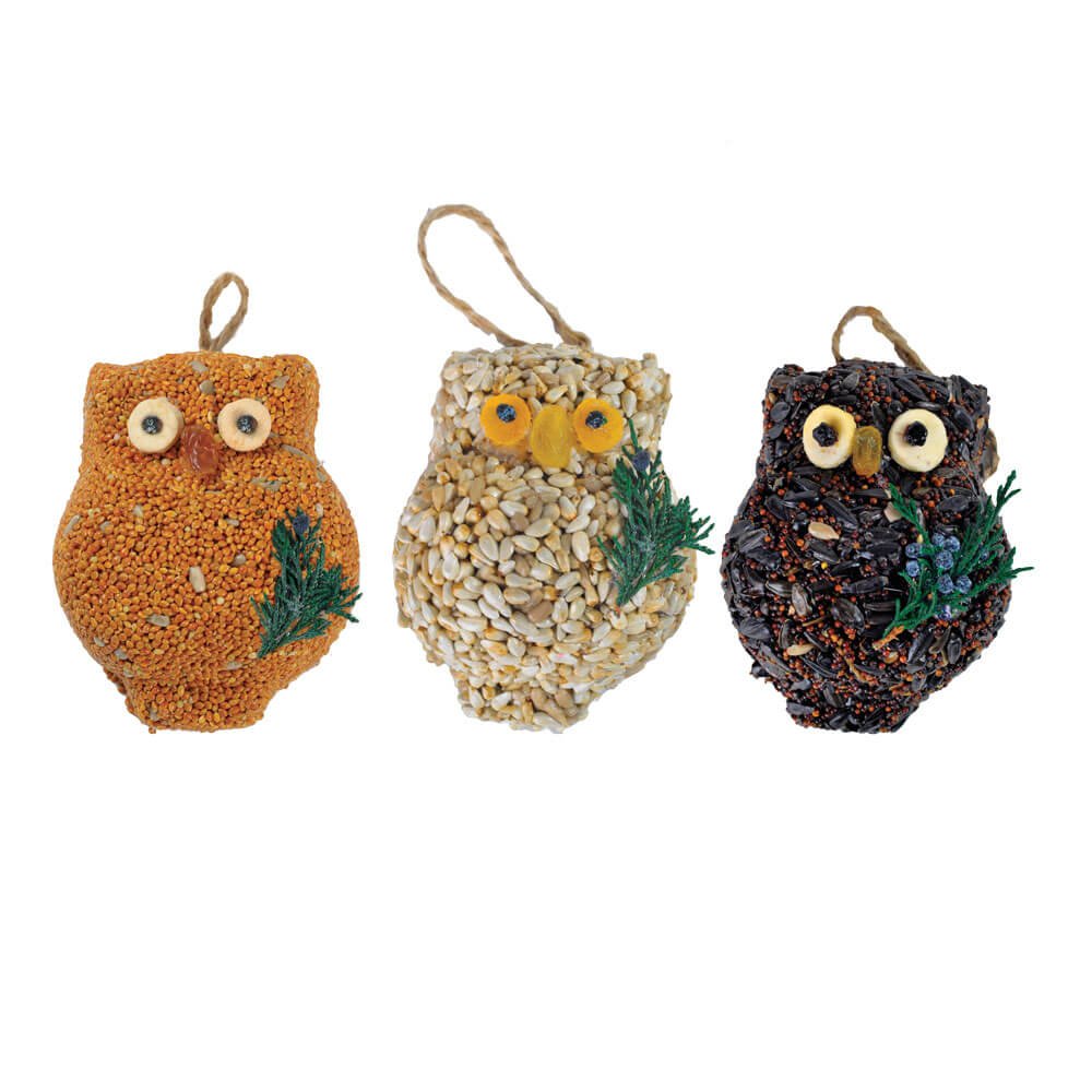 Three owl-shaped bird feeders with different color schemes on a white background