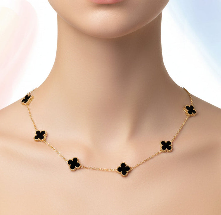 Gold necklace with floral designs on a woman's neck