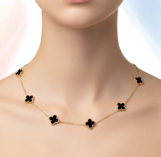 Gold necklace with floral designs on a woman's neck