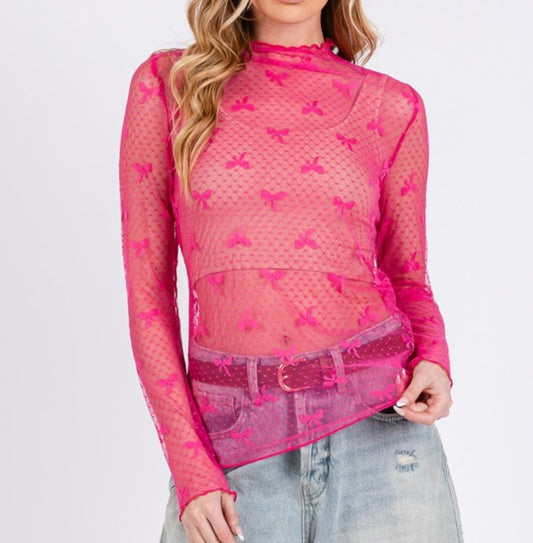 A hot pink sheer lace mesh top with bow print, long sleeves, and a mock neck.