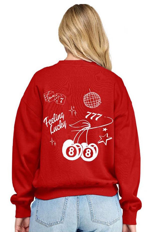Red sweatshirt with white graphics and text worn by a person on a white background
