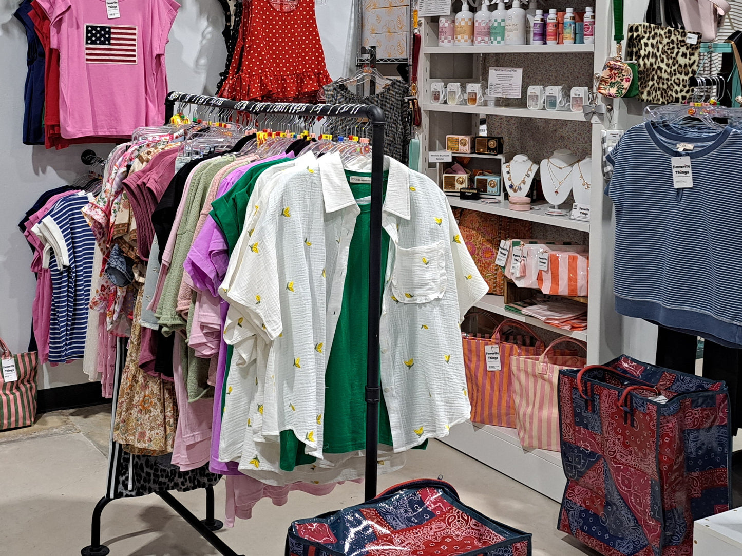 Store interior with clothing racks and shelves displaying various items.