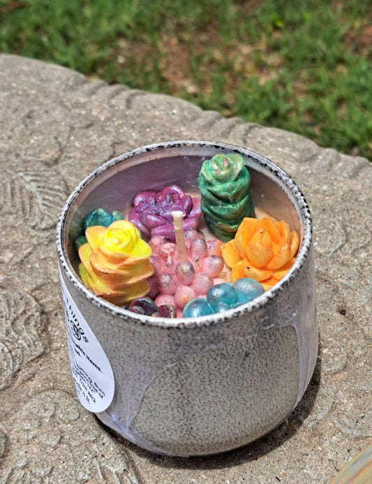 small container with wax cacti candles