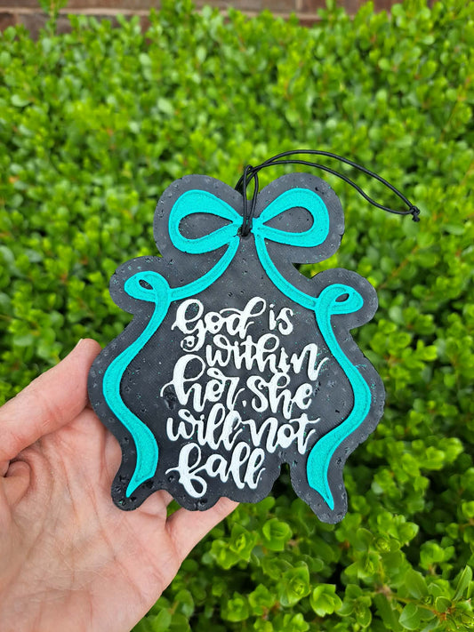 Decorative sign with 'God is within her, she will not fall' text held against a green bush background.