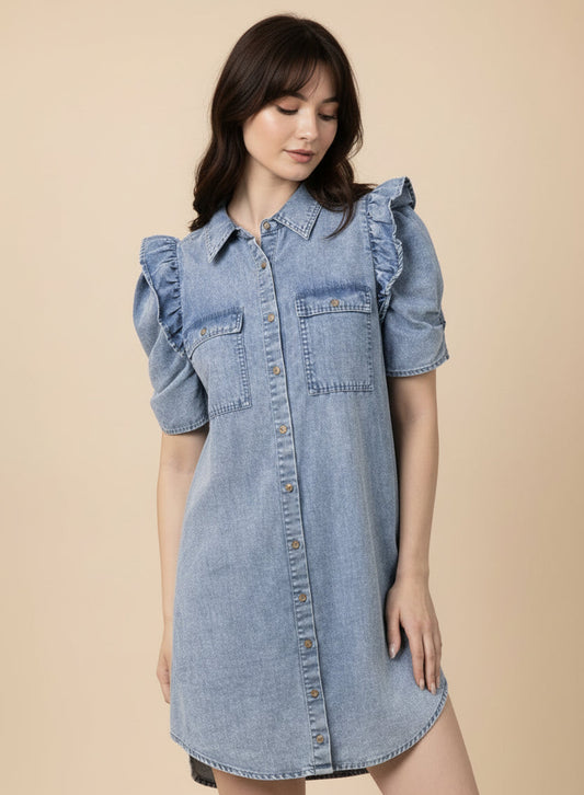 Girl wearing a denim dress with ruffled sleeves against a pink background