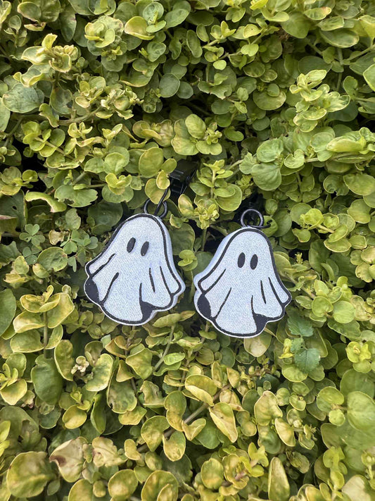 white ghost vent clips with black trim. Greenery background