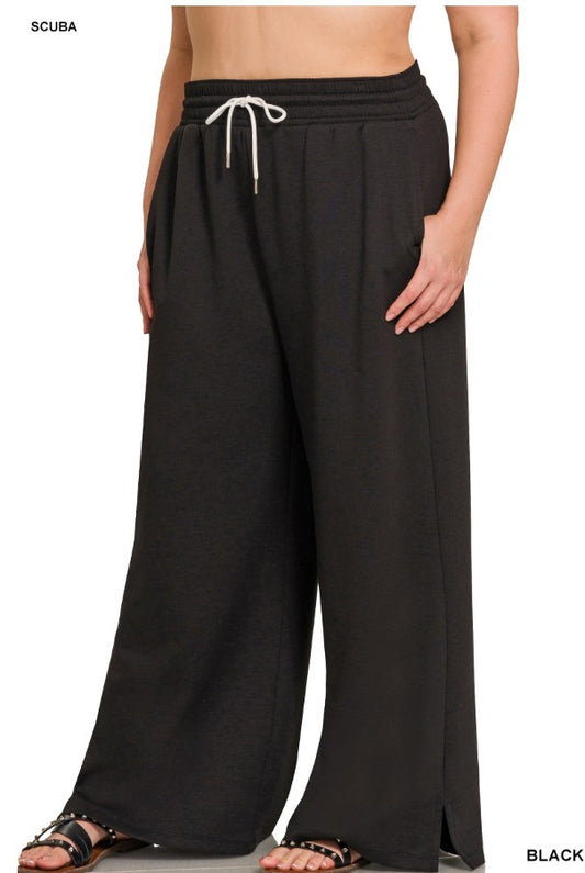 Black wide-leg pants with a drawstring waist on a white background
