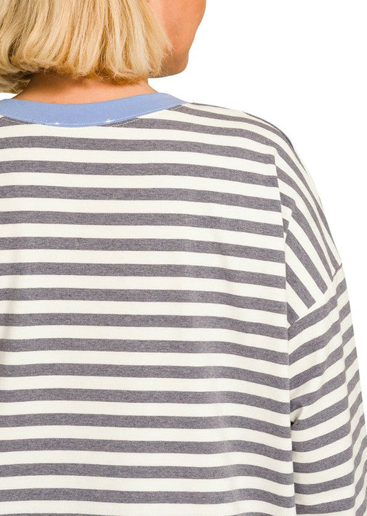 Close-up back view of a person wearing a long-sleeve striped shirt with charcoal and cornflower blue horizontal stripes, against a white background.