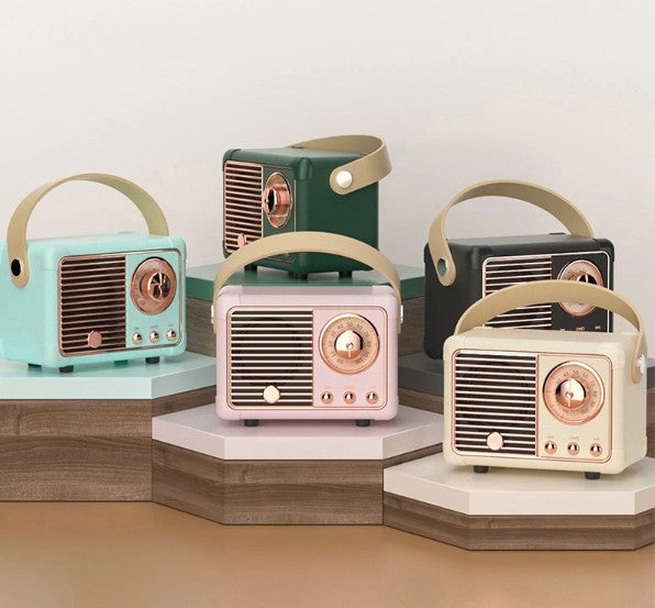 Set of vintage-style radios in different colors on a neutral background