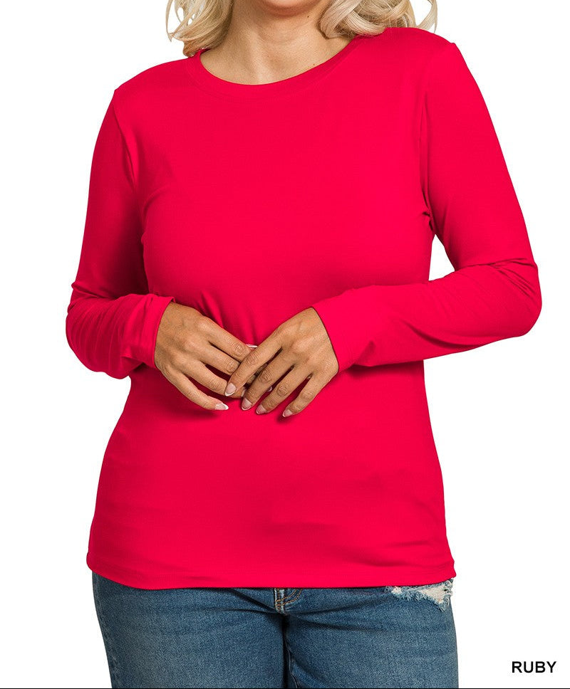 Woman wearing a red long-sleeve top on a white background