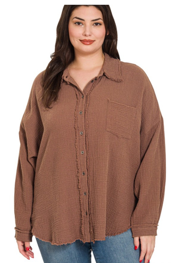 Woman wearing a brown gauze shirt on a white background