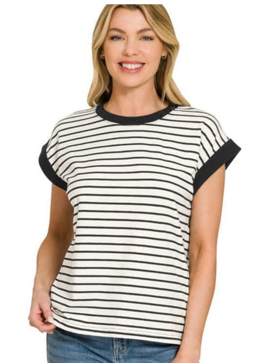 Woman wearing a black and white striped shirt on a white background