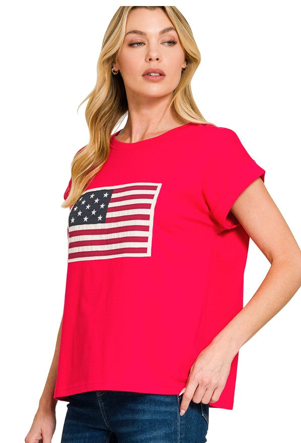 Woman wearing a red t-shirt with an American flag design on a white background