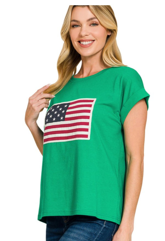 Woman wearing a green t-shirt with an American flag design on a white background