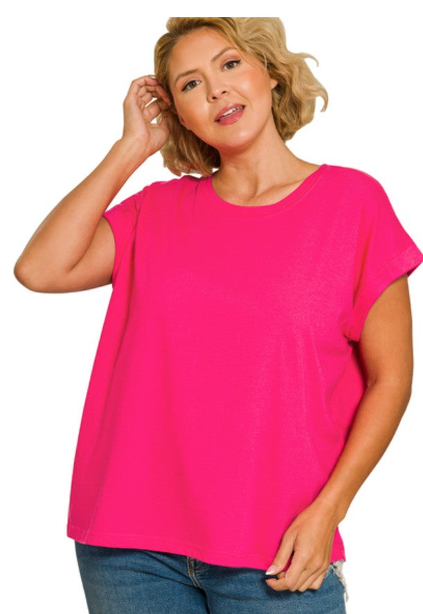 Woman wearing a bright pink t-shirt on a white background