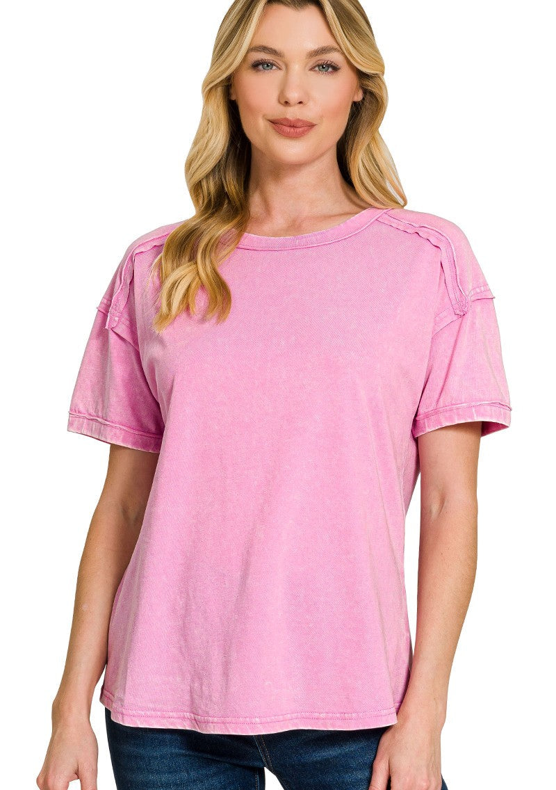 Woman wearing a mauve top on a white background