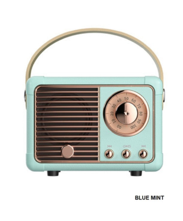 Vintage-style radio with blue mint body and rose gold accents on a white background