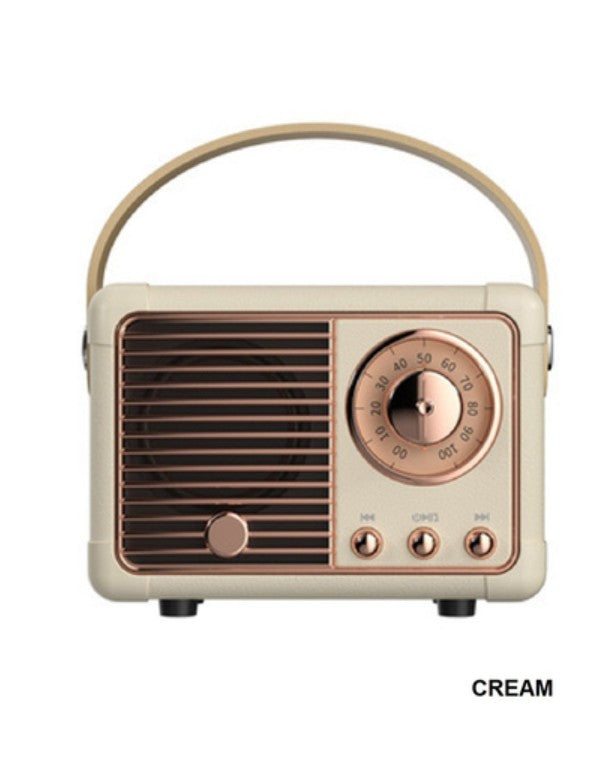 Vintage-style radio with a cream and rose gold color scheme on a white background.