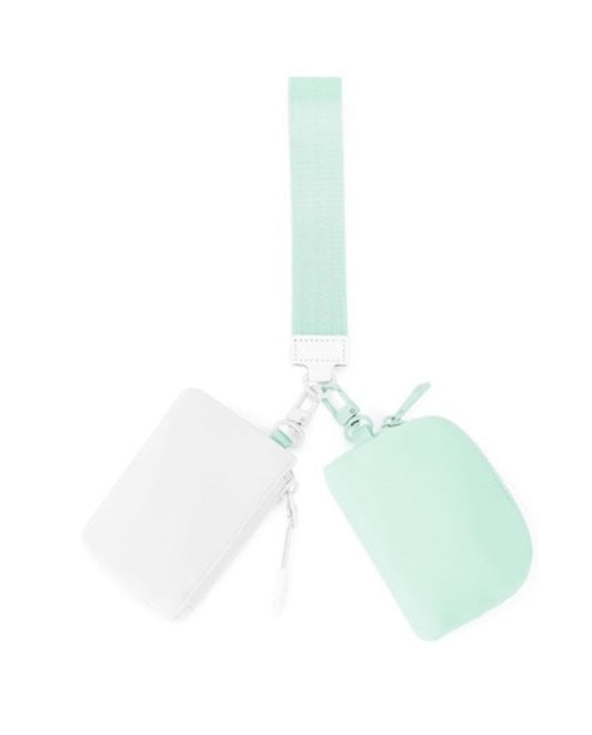mint green and white wristlet bags on a white background