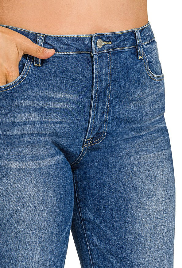 Close-up of blue jeans with a white background