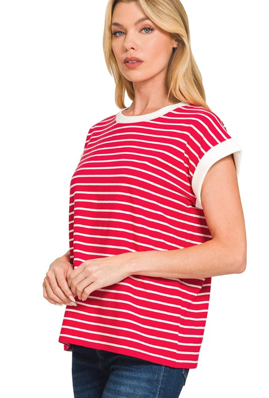 Woman wearing a red and white striped shirt on a plain background