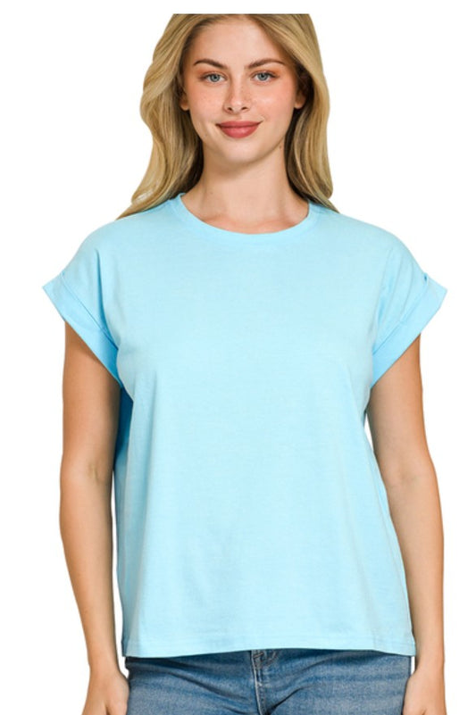 Woman wearing a light blue t-shirt against a white background